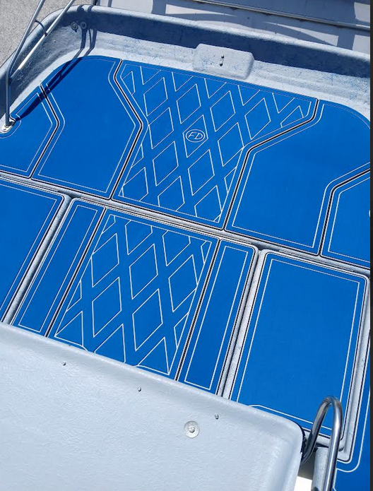 Aquatic blue FlexDek marine flooring with custom routed pattern