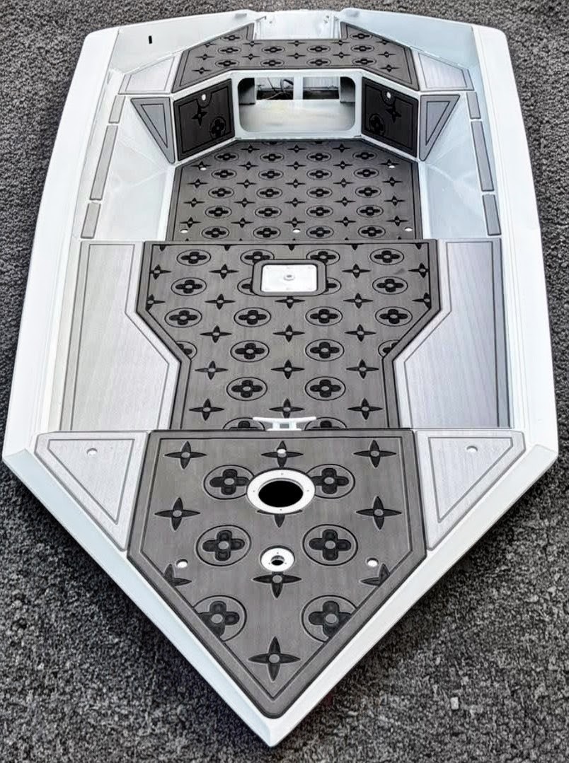 Custom gray FlexDek bow deck flooring with routed EVA foam panels for easy cleaning