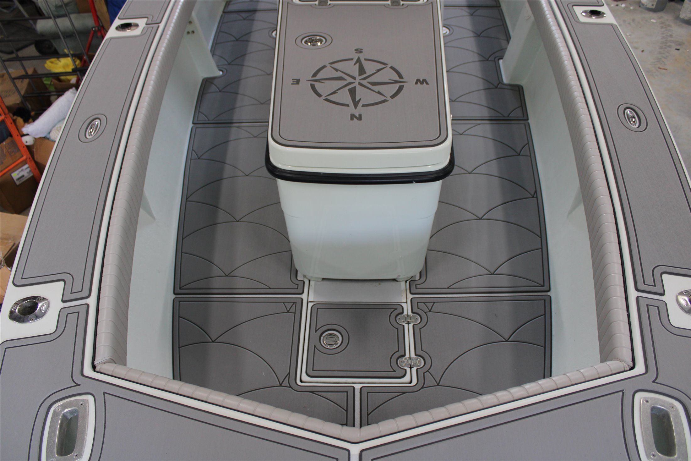 Gray FlexDek marine flooring installation on a boat bow