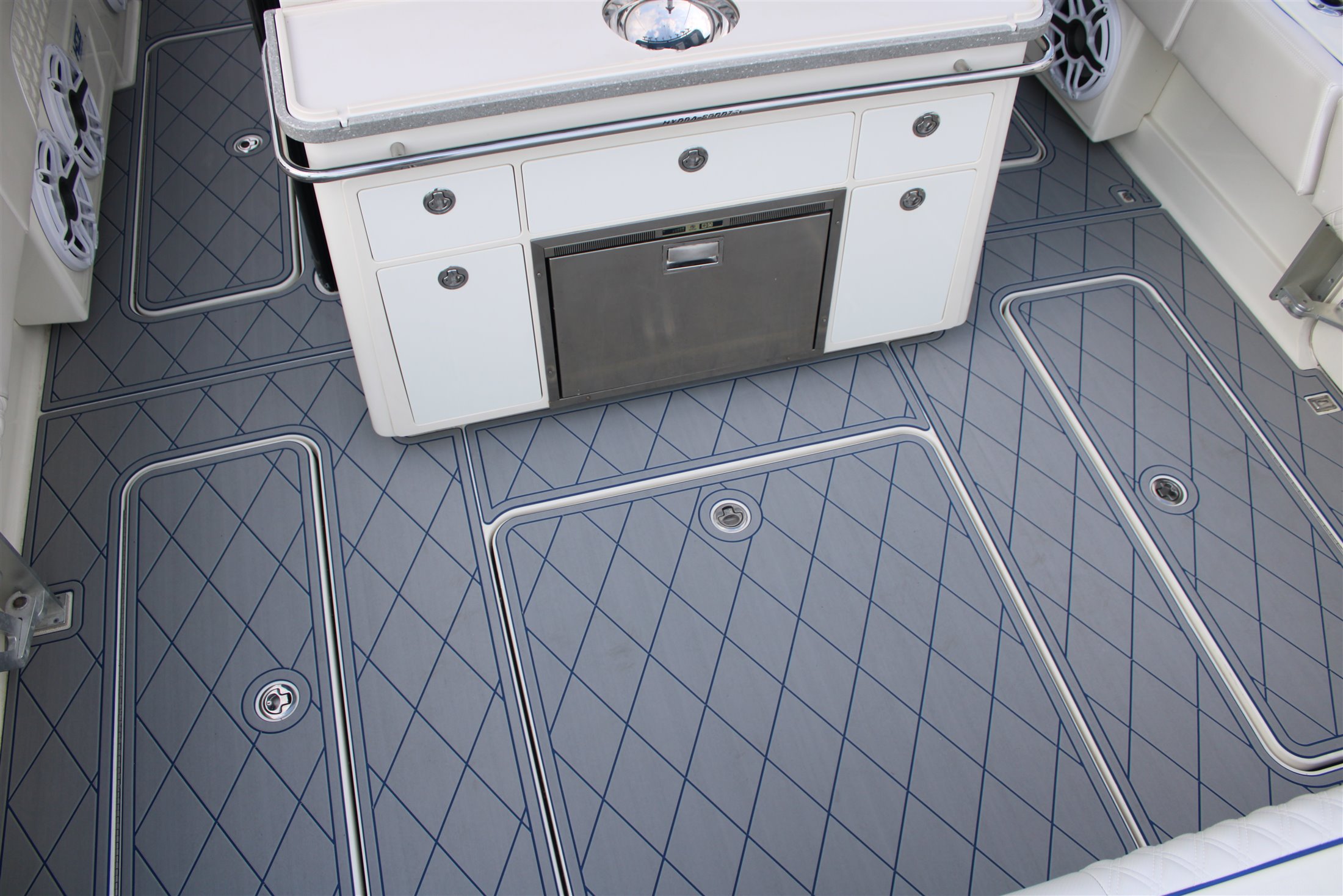 Custom gray FlexDek boat deck flooring with routed diamond accents