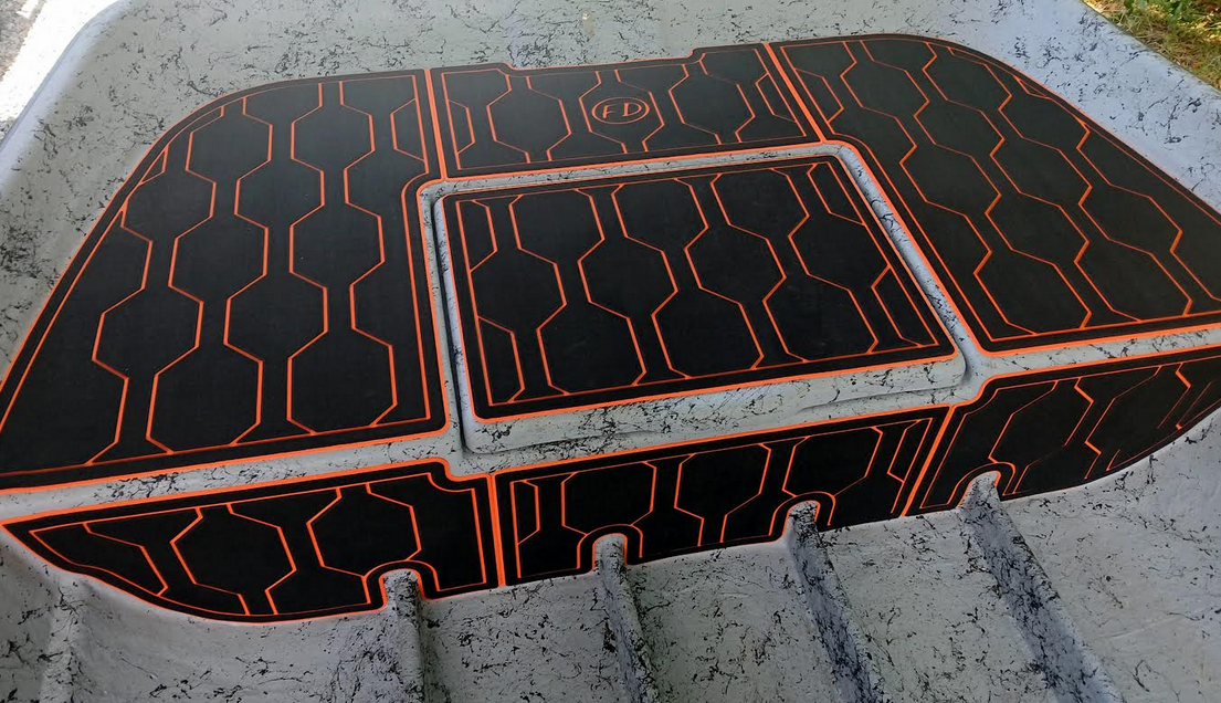 Red over black FlexDek honeycomb cooler pad with custom routed design
