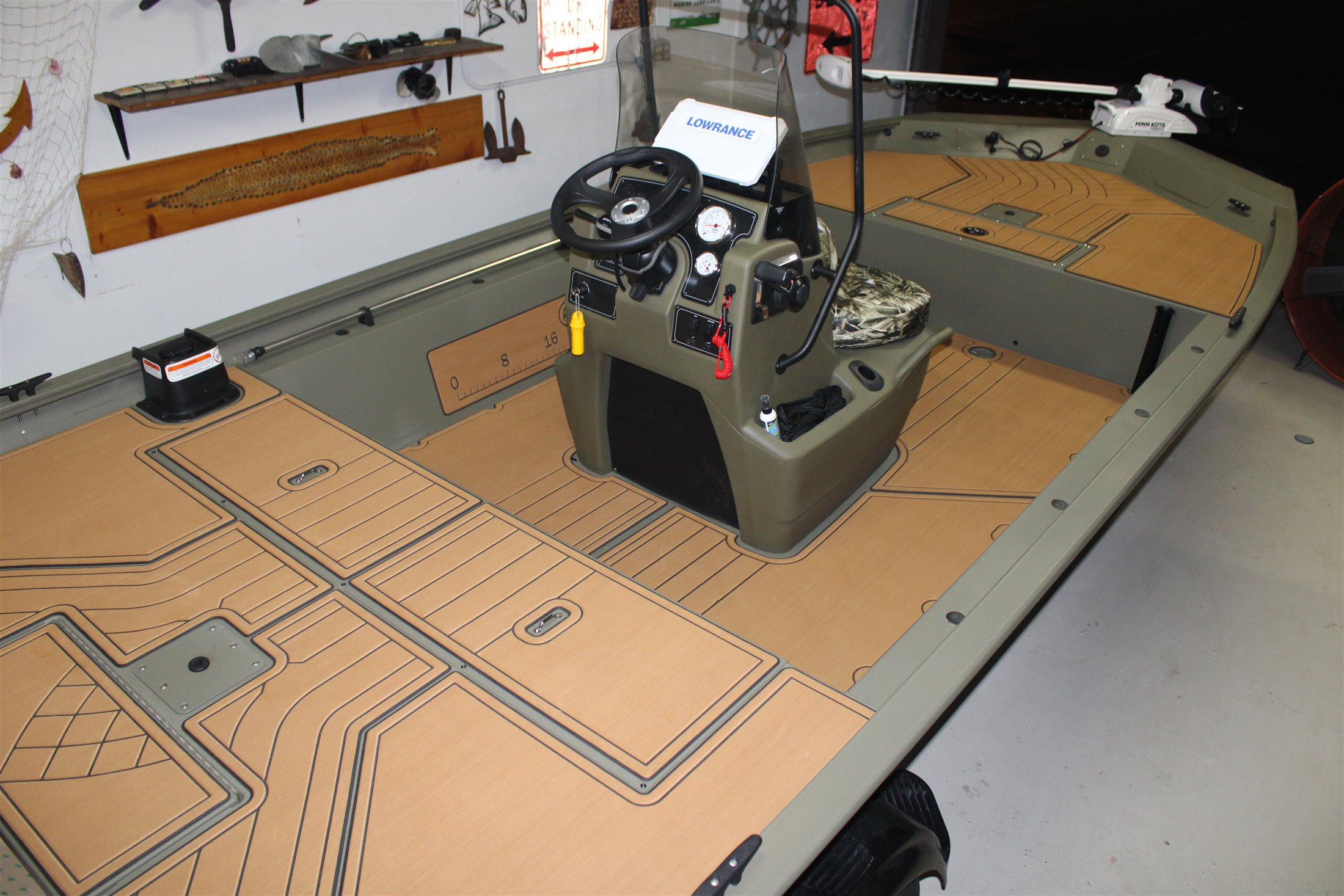 FlexDek cushioned boat deck flooring installed around a center-console boat