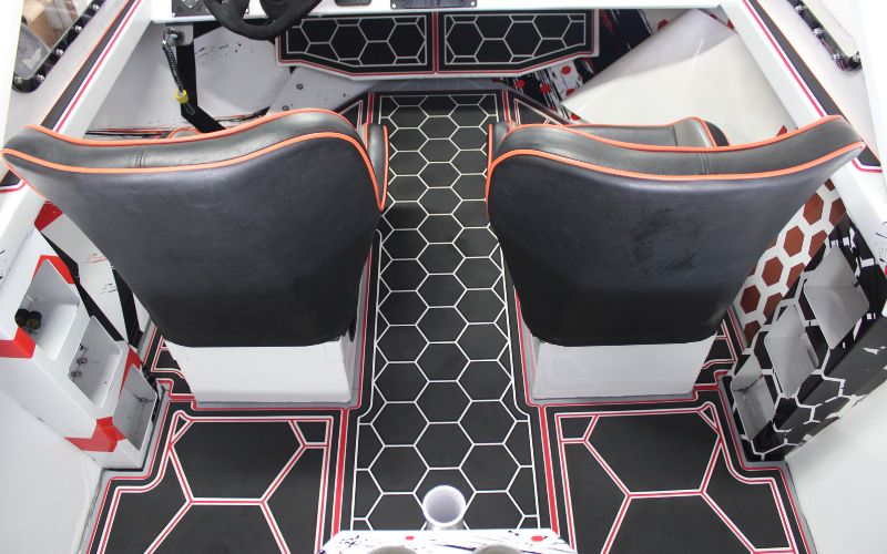 FlexDek tri-color honeycomb marine mat installed around boat seating